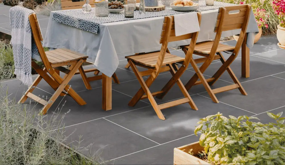 Image of a close-up view of an Ardesia Grey Outdoor Porcelain Paving Slab, showcasing its elegant grey finish and clean-cut sawn edges. This high-quality product is perfect for creating a durable and long-lasting outdoor space.