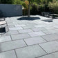 Blue limestone paving slabs used as flooring in a garden